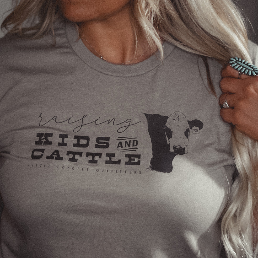 “Raising Kids and Cattle” Adult Unisex Western Graphic Tee in Stone