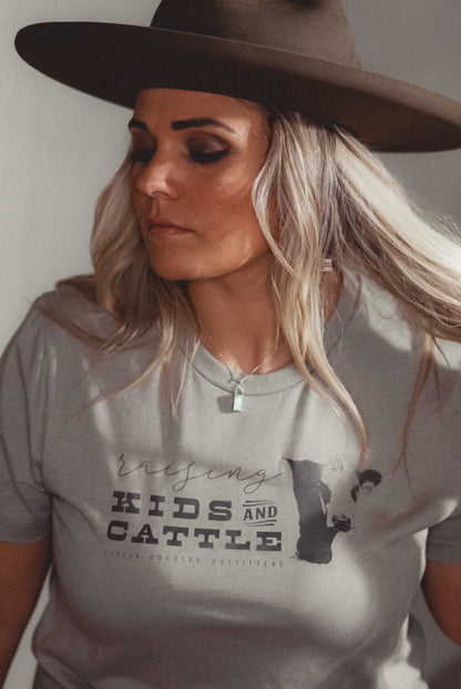 “Raising Kids and Cattle” Adult Unisex Western Graphic Tee in Stone